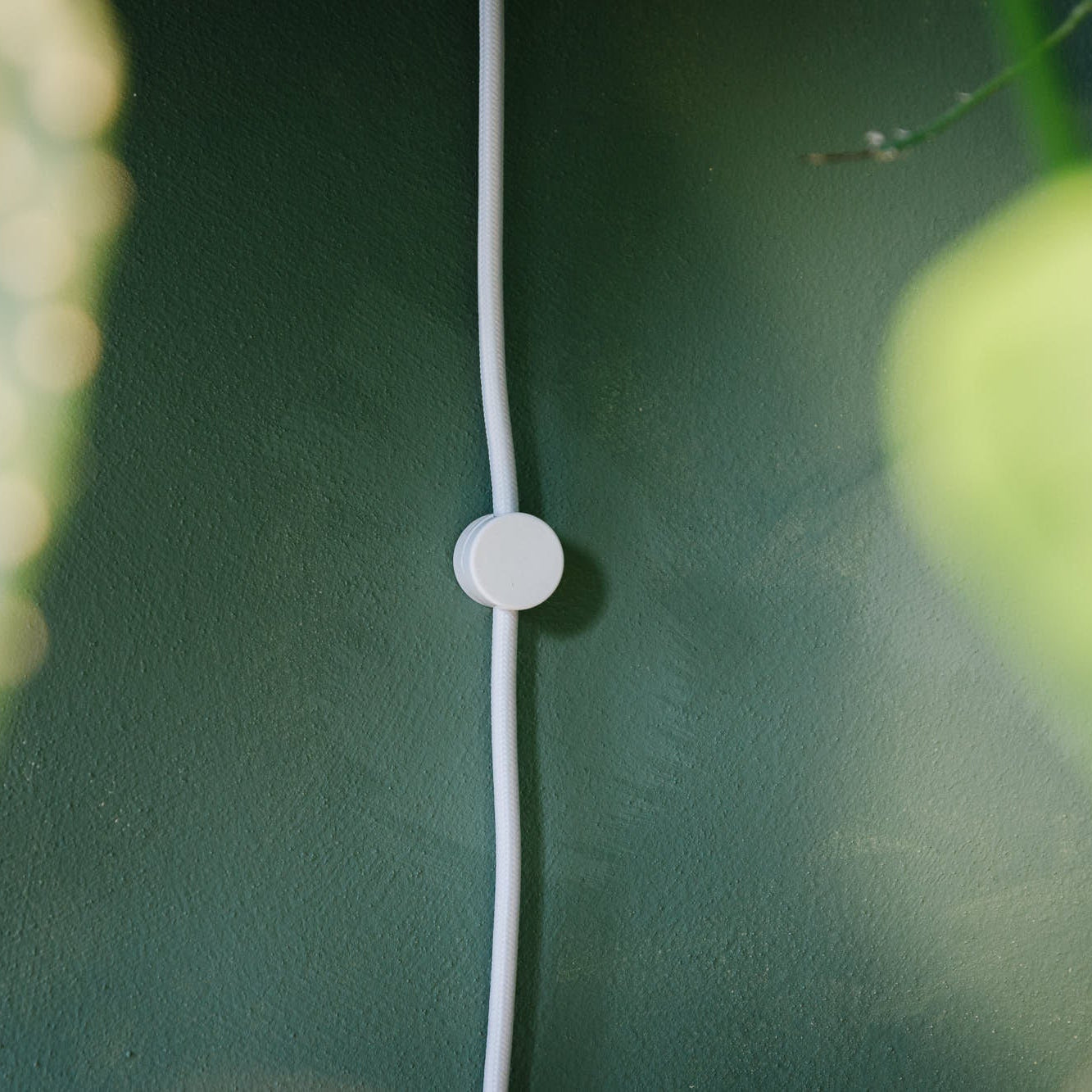 The wall fixture. Keeping the cable tidy